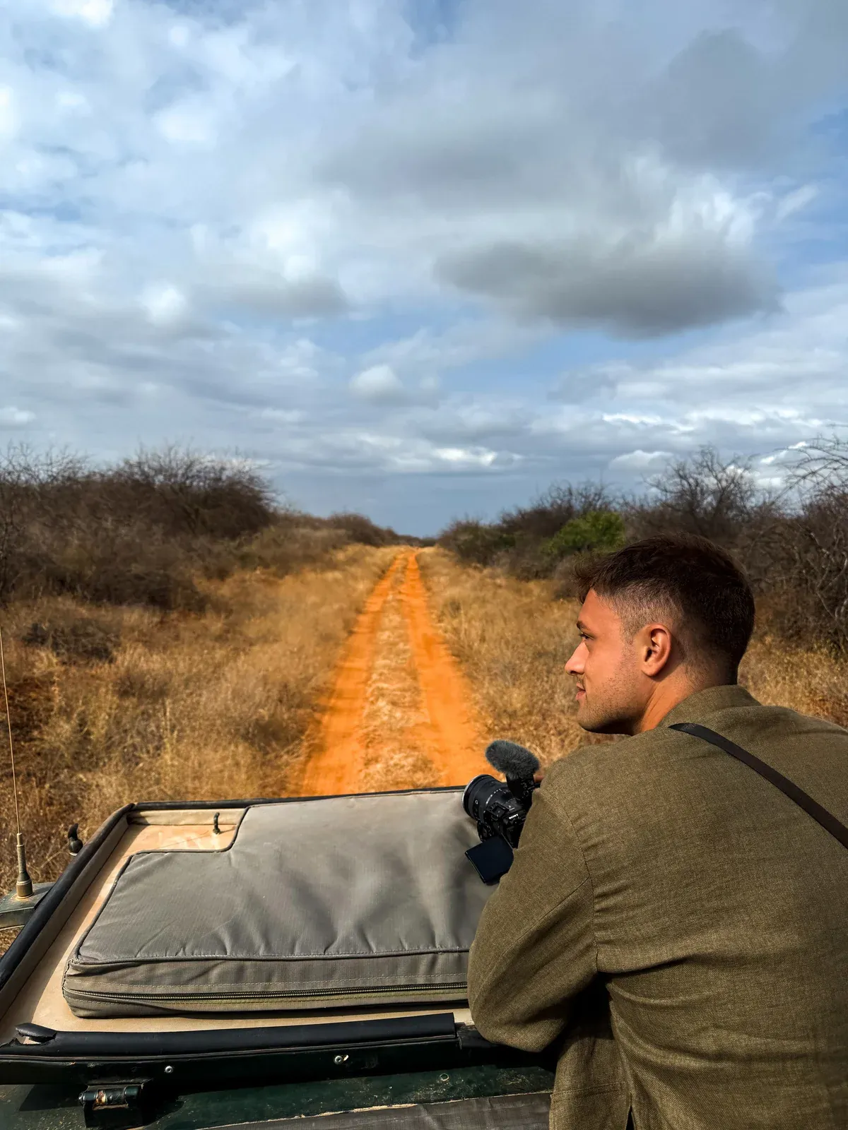 Braeden Almas filming from a safari vehicle in Kenya