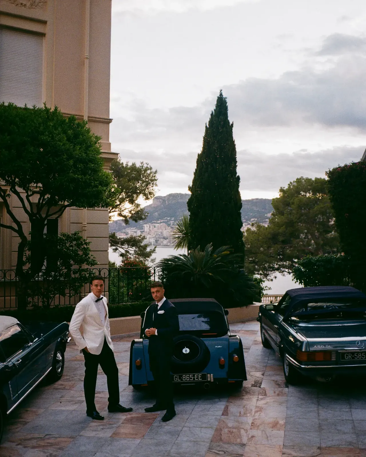 Classic cars and guests on a Monaco terrace
